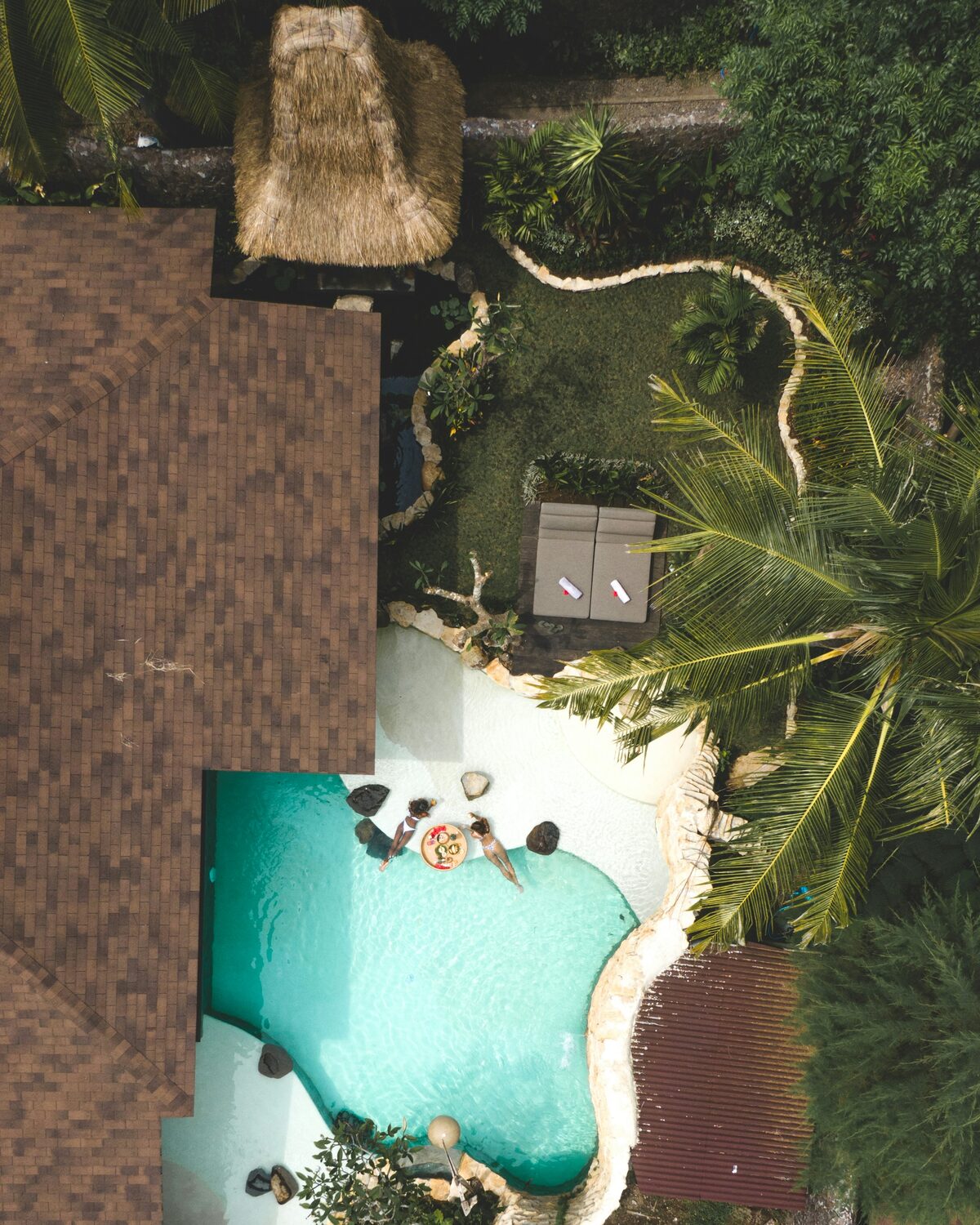 Aerial view of a hospitality stay surrounded by palms in Bali